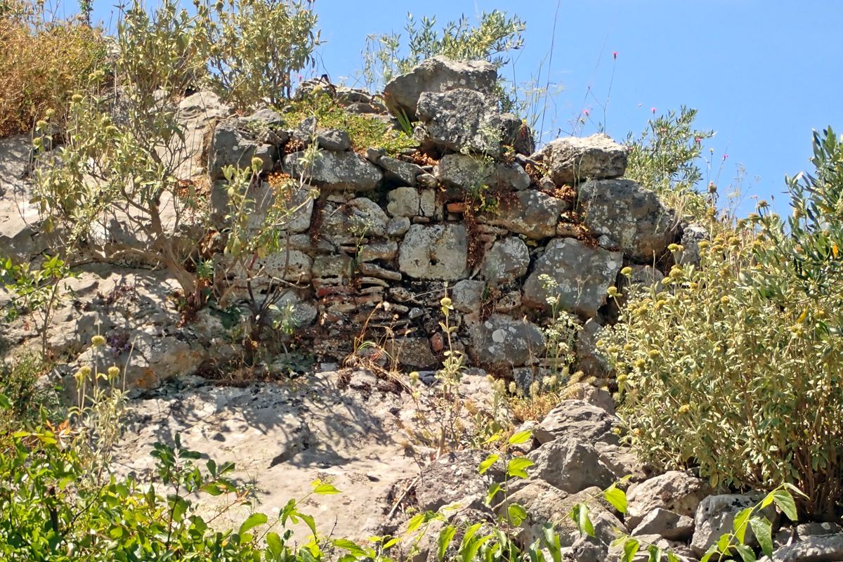ruins in the middle of the top of the hill
