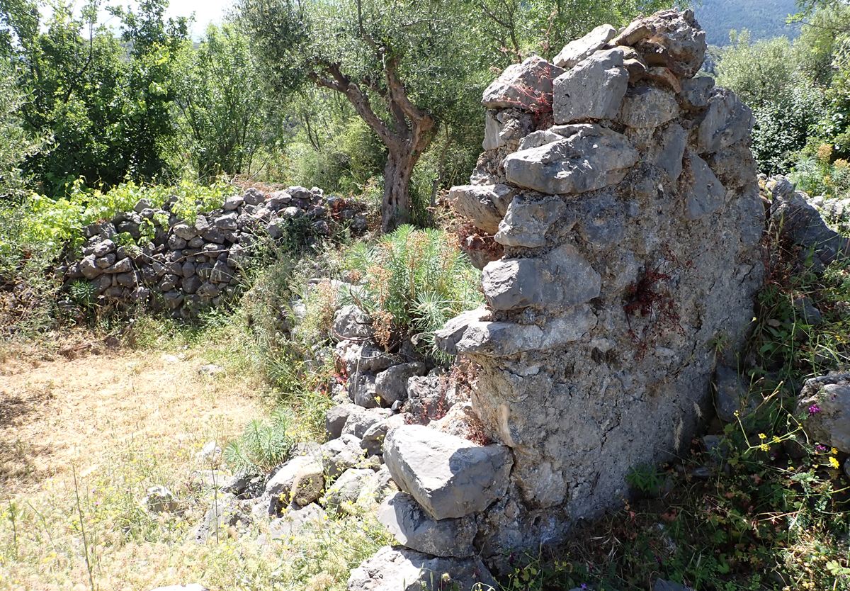 ruins of a building, possibly a church,  at the top of the castle